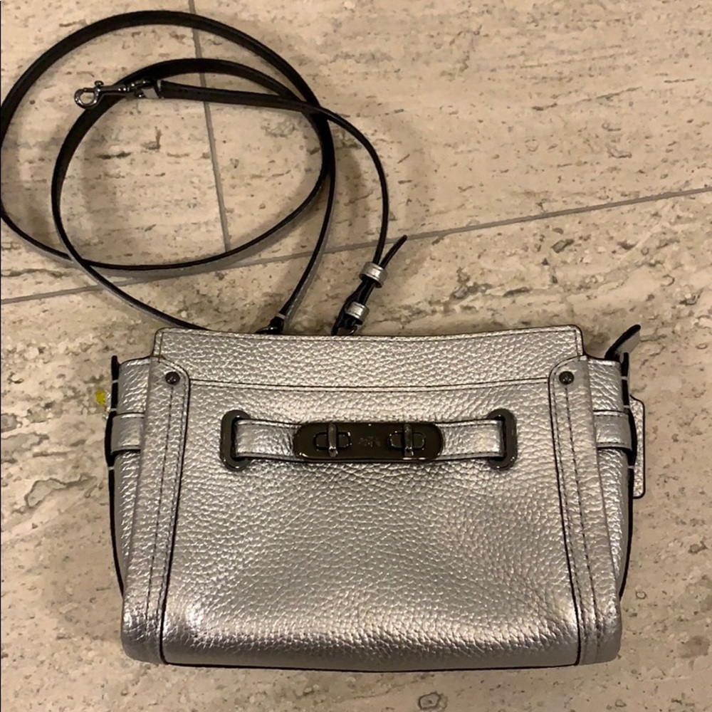 Coach clutch with strap